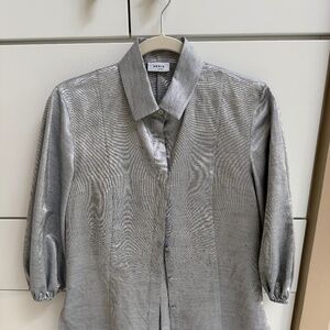 Woman’s shimmery blouse by Akris Punto size 6